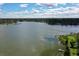 Stunning aerial view of a serene lake surrounded by lush greenery and residences at 380 Lake Ontario Ct # 304, Altamonte Springs, FL 32701