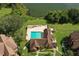 Aerial view showcases community pool, sun deck, and lake access amongst verdant landscaping and well-maintained buildings at 380 Lake Ontario Ct # 304, Altamonte Springs, FL 32701