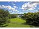 Expansive backyard with lush lawn and picturesque lake views at 380 Lake Ontario Ct # 304, Altamonte Springs, FL 32701