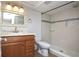Well-lit bathroom with tile flooring, vanity with granite countertop, and tiled walk-in shower at 380 Lake Ontario Ct # 304, Altamonte Springs, FL 32701