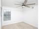 Neutral bedroom offers a ceiling fan and large window with abundant natural light at 380 Lake Ontario Ct # 304, Altamonte Springs, FL 32701