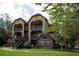 A condo with dual balconies surrounded by trees at 380 Lake Ontario Ct # 304, Altamonte Springs, FL 32701