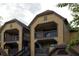 Condo building exterior featuring balconies with dark railings and wood siding at 380 Lake Ontario Ct # 304, Altamonte Springs, FL 32701