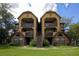 Attractive condo with covered patios, brick facade, and well-maintained landscaping at 380 Lake Ontario Ct # 304, Altamonte Springs, FL 32701