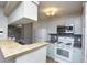 Well-equipped kitchen featuring modern appliances and breakfast bar at 380 Lake Ontario Ct # 304, Altamonte Springs, FL 32701
