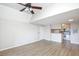 Open-concept living room with wood floors and access to a kitchen at 380 Lake Ontario Ct # 304, Altamonte Springs, FL 32701