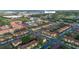 Aerial view of neighborhood complex, community pool, clubhouse and residential area with mature landscaping at 412 Verona Ave, Davenport, FL 33897