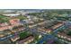 Aerial view of neighborhood complex, community pool, clubhouse and residential area with mature landscaping at 412 Verona Ave, Davenport, FL 33897