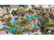 Aerial view of resort community featuring pools, lush landscaping, and lounging areas at 412 Verona Ave, Davenport, FL 33897