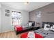Comfortable bedroom featuring two beds, stylish decor, and bright natural light at 412 Verona Ave, Davenport, FL 33897