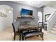 Comfortable dining area featuring a sleek table, a TV, and stairs at 412 Verona Ave, Davenport, FL 33897