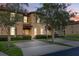 Inviting two-story townhome with lush landscaping and private entrances at 412 Verona Ave, Davenport, FL 33897