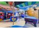 Spacious game room with arcade games, pool table, and indoor playground for Gathering fun at 412 Verona Ave, Davenport, FL 33897