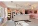 Interior of an ice cream shop with pink walls, retro tile flooring, and a service counter at 412 Verona Ave, Davenport, FL 33897