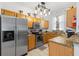Charming kitchen with stainless steel appliances, granite countertops, and ample cabinet space at 412 Verona Ave, Davenport, FL 33897