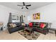 Comfortable seating arrangement in living room with modern ceiling fan and decorations at 412 Verona Ave, Davenport, FL 33897