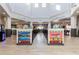Bright, open lobby area with signs pointing to the pool, arcade, and restroom at 412 Verona Ave, Davenport, FL 33897
