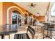 Outdoor dining area with ceiling fans and multiple large windows at 412 Verona Ave, Davenport, FL 33897