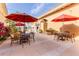 Inviting outdoor dining area with umbrella-shaded tables, potted plants, and charming storefronts at 412 Verona Ave, Davenport, FL 33897
