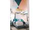 Tastefully decorated bedroom with geometric ceiling art, comfortable bed, and elegant furnishings for a relaxing retreat at 4161 Paragraph Dr, Kissimmee, FL 34746