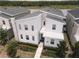 Modern two-story home showcasing clean lines and a well-manicured lawn in a desirable location at 4161 Paragraph Dr, Kissimmee, FL 34746