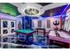 Spacious game room with a pool table, foosball table, and Star Wars decor at 4161 Paragraph Dr, Kissimmee, FL 34746