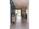 Stylish hallway with tile flooring that opens up to the bright living room and a beautiful view of the pool at 4161 Paragraph Dr, Kissimmee, FL 34746