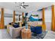 Cozy living room featuring stylish furnishings and a large television at 4161 Paragraph Dr, Kissimmee, FL 34746