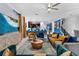 Open concept living room with modern furniture and decor with bright pops of color at 4161 Paragraph Dr, Kissimmee, FL 34746