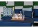 Outdoor patio with decorative accents and a bottle of champagne, creating a stylish and welcoming ambiance at 4161 Paragraph Dr, Kissimmee, FL 34746