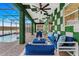 Inviting screened patio with comfortable seating, overlooking a sparkling pool and lush scenery for outdoor relaxation and entertainment at 4161 Paragraph Dr, Kissimmee, FL 34746