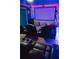 This home theater offers tiered seating, a large screen, and cool lighting for an immersive entertainment experience at 4161 Paragraph Dr, Kissimmee, FL 34746