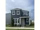 Charming two-story home features a gray exterior, white trim, well-manicured lawn, and neatly landscaped front yard at 446 Scotsmans Pl, Debary, FL 32713