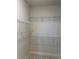 Empty walk-in closet with adjustable metal shelving at 446 Scotsmans Pl, Debary, FL 32713