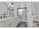 Modern bathroom features double vanity with sleek black fixtures and a shower with glass doors at 523 W Princeton St # 1, Orlando, FL 32804
