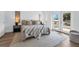 Inviting bedroom with neutral tones, balcony access, and stylish decor at 523 W Princeton St # 1, Orlando, FL 32804