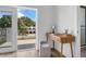 Bright bedroom with a vanity table, stool, and balcony access at 523 W Princeton St # 1, Orlando, FL 32804