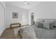 Bright bedroom with wood floor and a comfy bed with many pillows at 523 W Princeton St # 1, Orlando, FL 32804