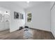Bright bedroom with wood floor and a mirror next to a bathroom door at 523 W Princeton St # 1, Orlando, FL 32804