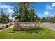 The brick College Park welcome sign surrounded by lush landscaping at 523 W Princeton St # 1, Orlando, FL 32804