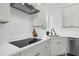 Modern kitchen featuring white cabinets, sleek countertops, and stainless steel appliances at 523 W Princeton St # 1, Orlando, FL 32804