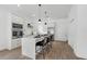 Modern kitchen with white cabinets, quartz countertops, and stainless steel appliances at 523 W Princeton St # 1, Orlando, FL 32804