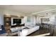 Open-concept living area with hardwood floors, modern furnishings, and a stylish lighting fixture at 523 W Princeton St # 1, Orlando, FL 32804