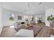 Open-concept living space with light hardwood floors and modern furnishings at 523 W Princeton St # 1, Orlando, FL 32804