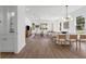 Bright, open living space with wood floors, dining area, and large windows at 523 W Princeton St # 1, Orlando, FL 32804