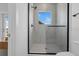 Modern bathroom featuring glass walk-in shower with tile surround and window at 523 W Princeton St # 1, Orlando, FL 32804