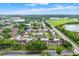 An aerial view of a condo complex with beautiful landscaping, community pond and convenient parking at 5545 Devonbriar Way # 206, Orlando, FL 32822