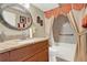 Bathroom with granite-topped vanity and shower-tub combo at 5545 Devonbriar Way # 206, Orlando, FL 32822