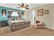 Comfortable bedroom with a plush bed, soft carpet, and stylish furnishings for a relaxing retreat at 5545 Devonbriar Way # 206, Orlando, FL 32822