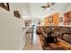 Living room featuring a decorative zebra statue, cozy seating area, tiled floors, and a ceiling fan above at 5545 Devonbriar Way # 206, Orlando, FL 32822